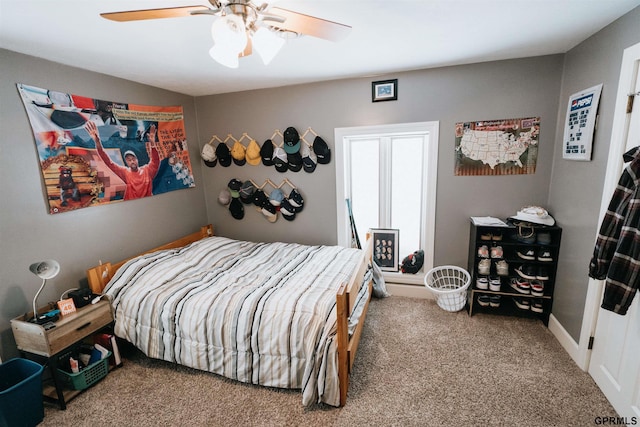 carpeted bedroom featuring a ceiling fan