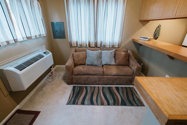 carpeted living room featuring plenty of natural light, electric panel, baseboards, and a wall mounted air conditioner