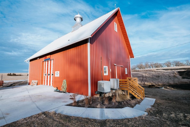 view of pole building featuring central air condition unit