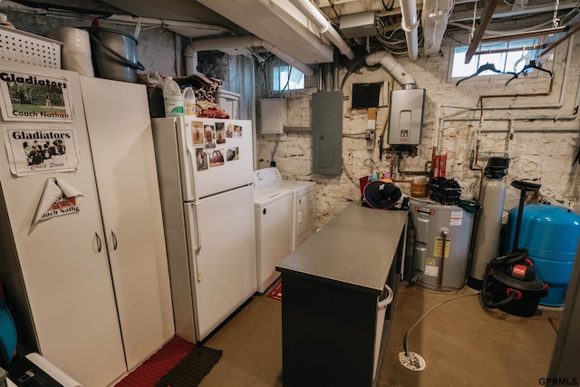 basement with water heater, independent washer and dryer, electric panel, and freestanding refrigerator