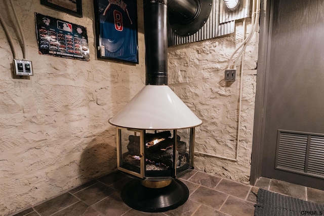 room details with a wood stove and visible vents