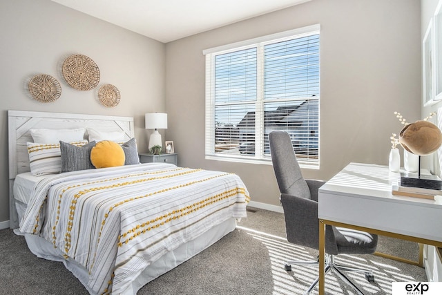 bedroom with carpet and baseboards