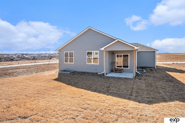 rear view of house with a patio