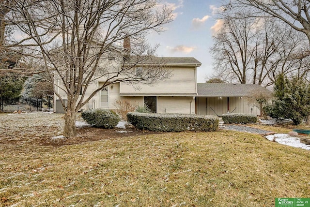 exterior space with a chimney and a front yard