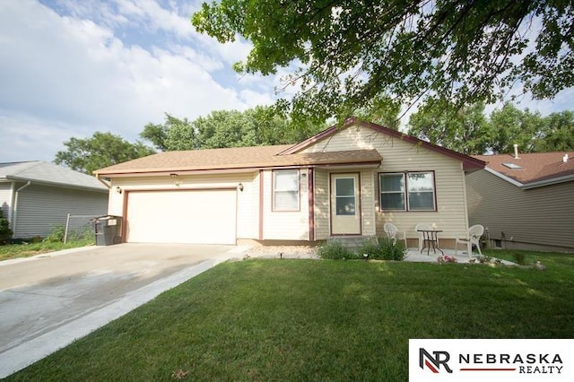 single story home with a front lawn, driveway, and an attached garage