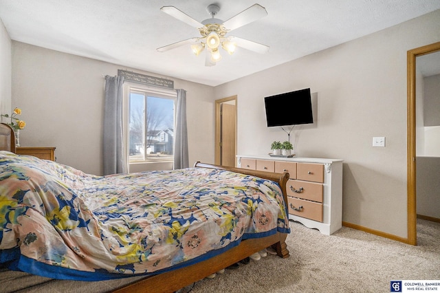 bedroom with light carpet, ceiling fan, and baseboards