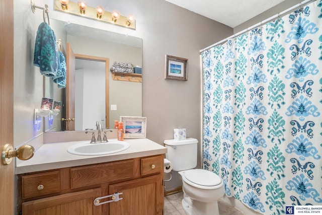 full bathroom with vanity, tile patterned floors, toilet, and a shower with shower curtain