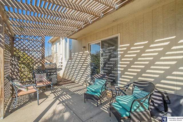 view of patio with a grill and a pergola