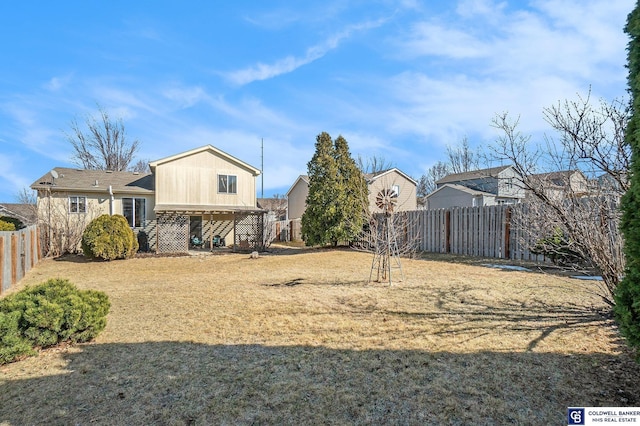 view of yard with a fenced backyard