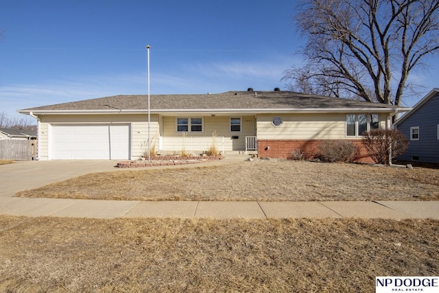 ranch-style home with a garage, concrete driveway, brick siding, and central air condition unit