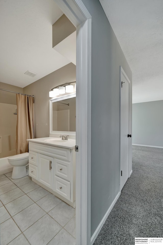 full bathroom with vanity, visible vents, a textured ceiling, tile patterned floors, and toilet