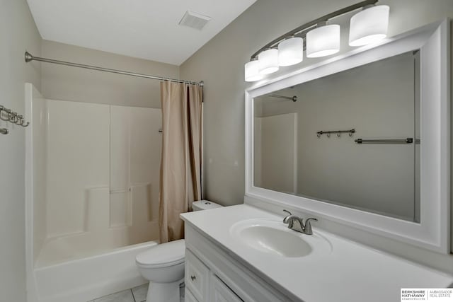 bathroom featuring vanity, visible vents, tile patterned flooring, shower / tub combo, and toilet