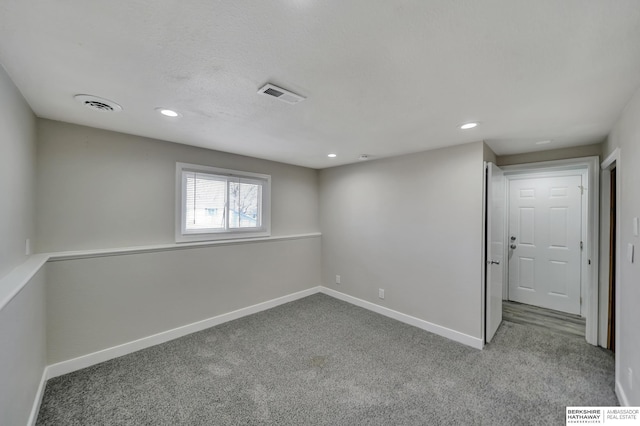 unfurnished room featuring recessed lighting, carpet, visible vents, and baseboards