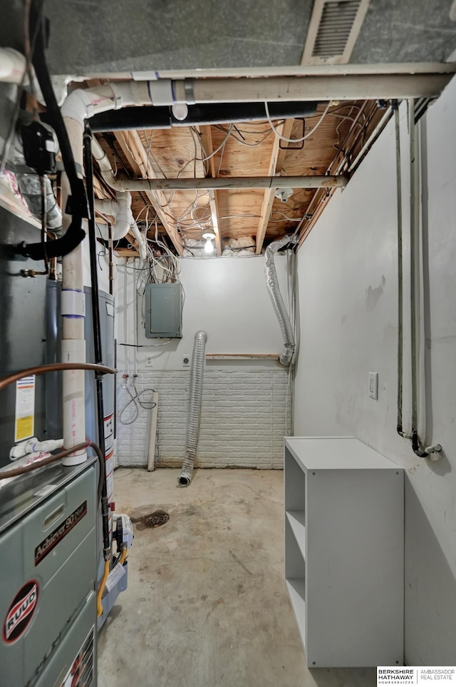 unfinished basement featuring electric panel and visible vents