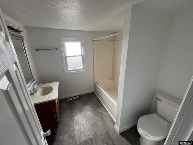 full bathroom with a textured ceiling, toilet, vanity, baseboards, and shower / bathing tub combination