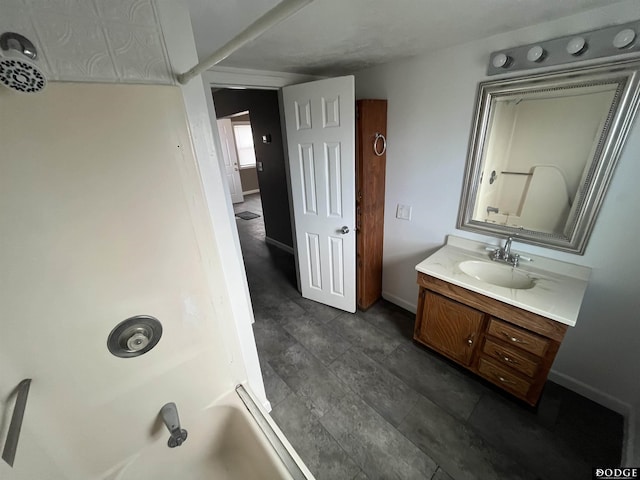 bathroom featuring vanity and baseboards