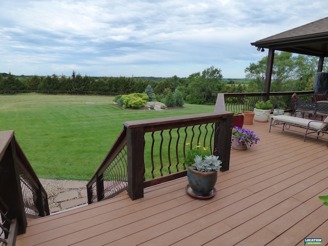 wooden deck with a lawn