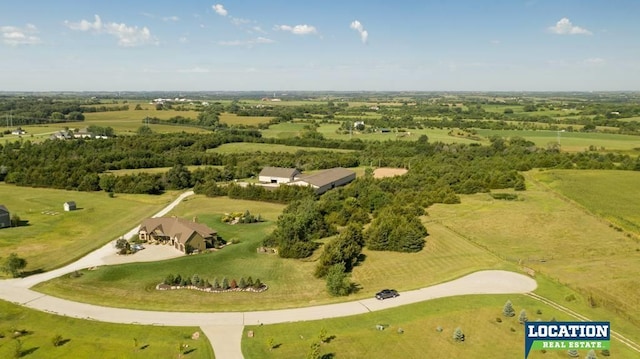 birds eye view of property with a rural view