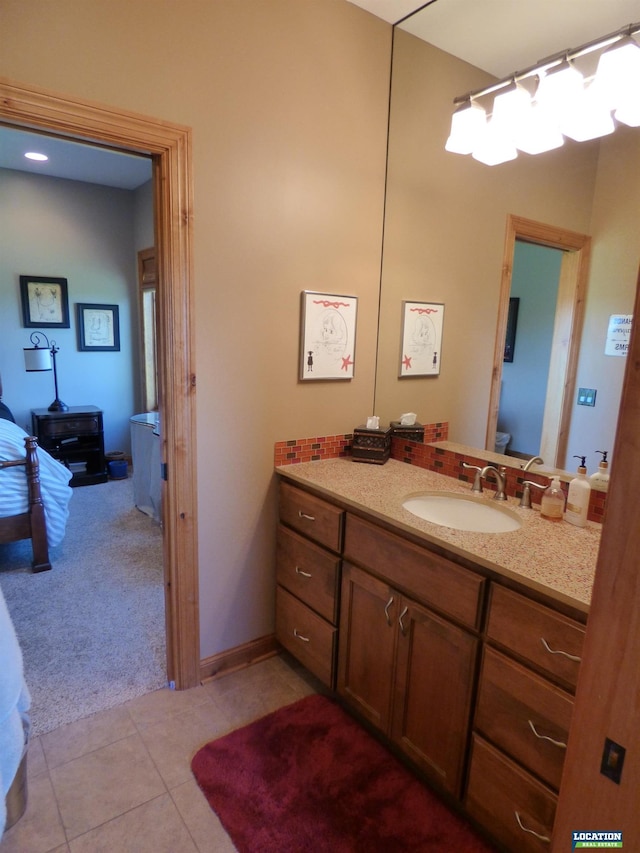 bathroom with tile patterned flooring and vanity