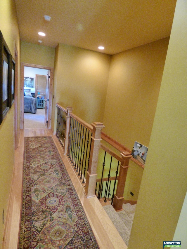 hall featuring recessed lighting and wood finished floors