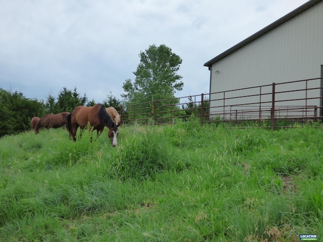 exterior space featuring an outbuilding and a rural view