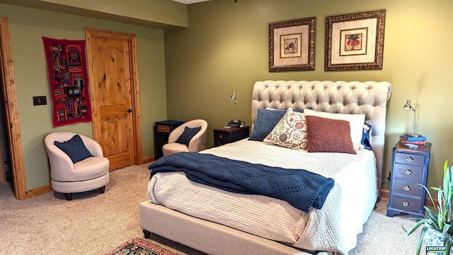 carpeted bedroom featuring baseboards