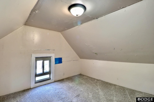 bonus room featuring carpet and vaulted ceiling