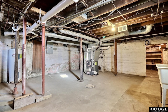 unfinished below grade area with electric panel, water heater, visible vents, and heating unit