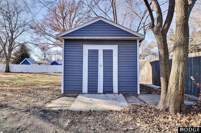 view of shed with fence