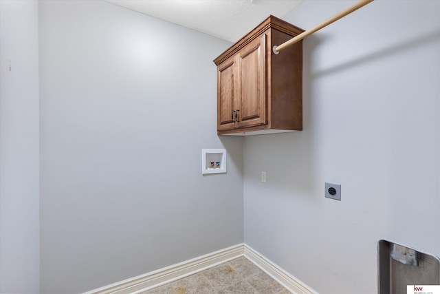 washroom with washer hookup, cabinet space, electric dryer hookup, and baseboards