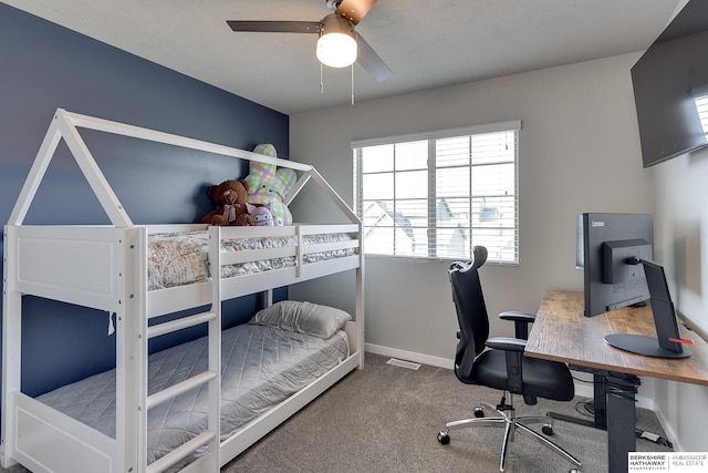 carpeted bedroom featuring visible vents, baseboards, and a ceiling fan