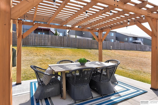 view of patio featuring outdoor dining area, a fenced backyard, and a pergola