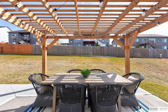 view of patio / terrace with a fenced backyard, outdoor dining space, and a pergola