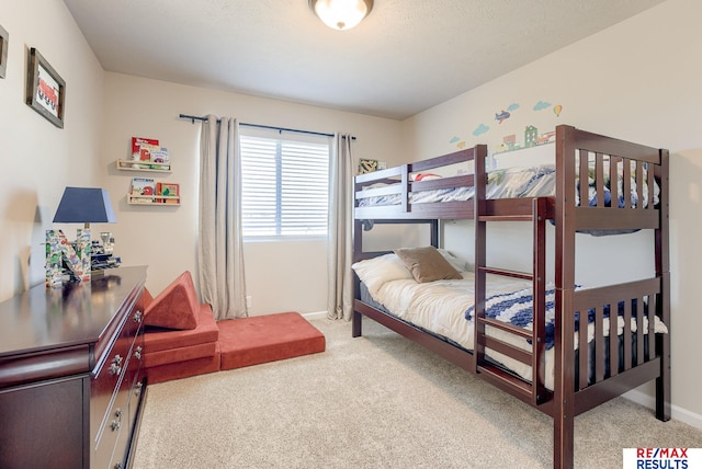 carpeted bedroom with baseboards