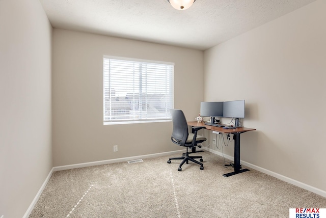 home office featuring visible vents, carpet, baseboards, and a textured ceiling