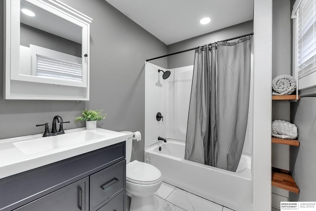 bathroom with toilet, marble finish floor, vanity, and shower / tub combo with curtain