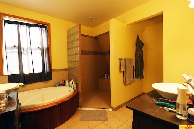 full bath with tile patterned flooring, a garden tub, vanity, and a shower stall