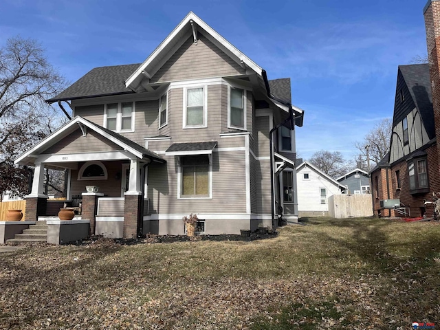 view of front of home featuring a porch and roof with shingles