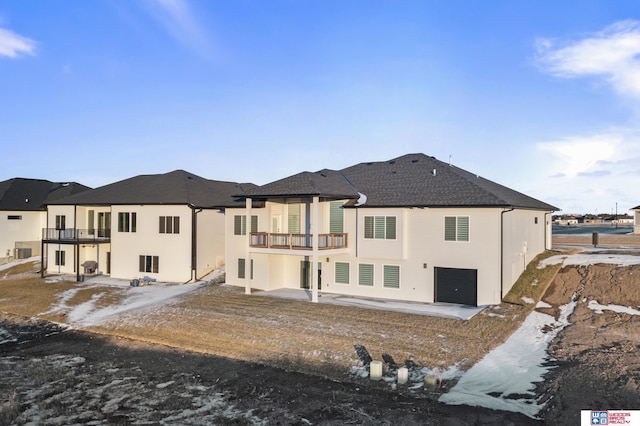 back of house with a balcony, cooling unit, and a patio