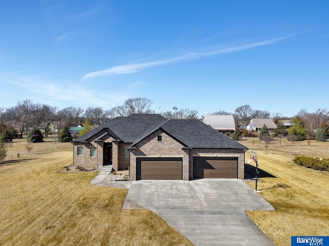 french provincial home featuring a garage, a shingled roof, brick siding, driveway, and a front yard