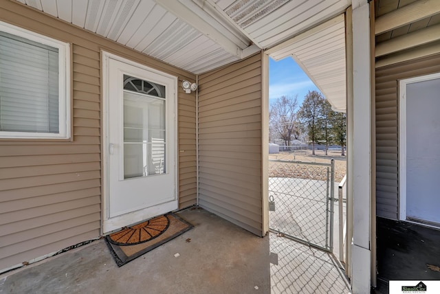 doorway to property with a gate and fence