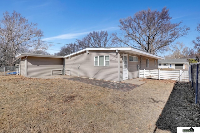 exterior space featuring a front yard and fence