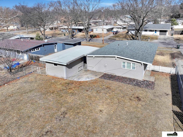 birds eye view of property with a residential view