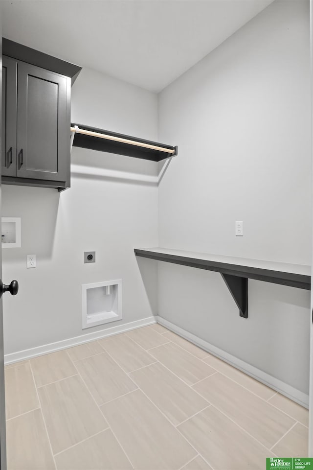 laundry room with cabinet space, baseboards, washer hookup, and electric dryer hookup