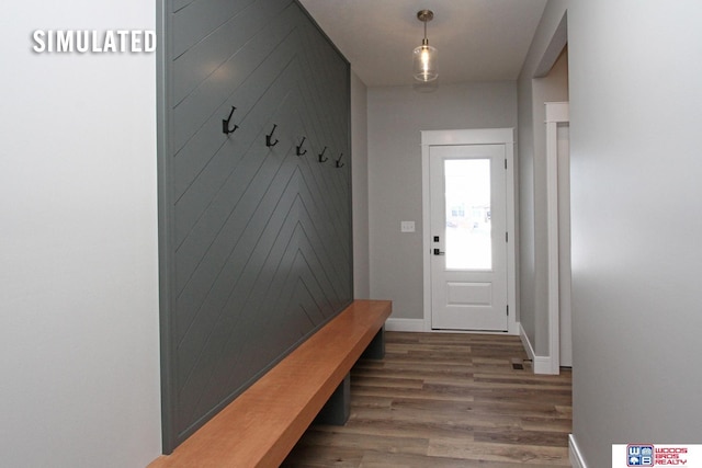 mudroom featuring baseboards and wood finished floors