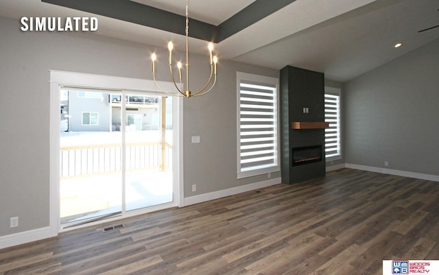 unfurnished dining area featuring baseboards, wood finished floors, visible vents, and a large fireplace