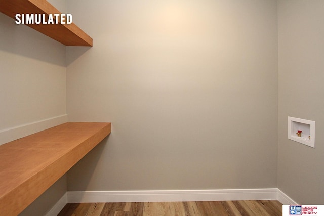 mudroom featuring wood finished floors, baseboards, and built in study area