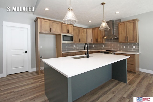 kitchen featuring electric stove, a sink, wood finished floors, wall chimney exhaust hood, and built in microwave