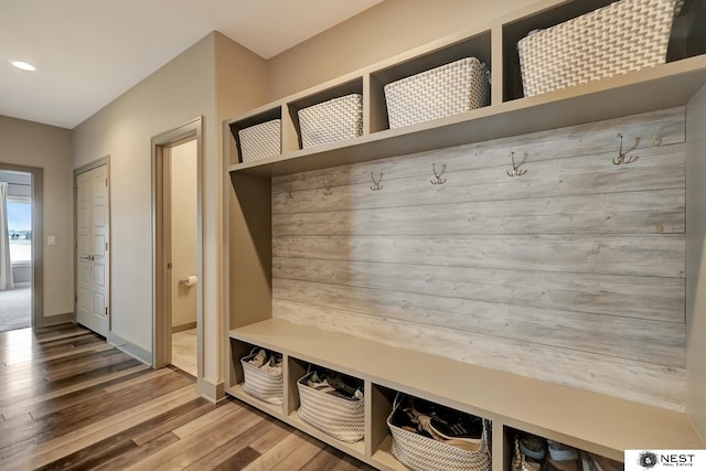 mudroom with baseboards, wood finished floors, and recessed lighting