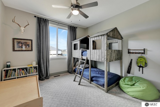 bedroom with carpet, visible vents, ceiling fan, and baseboards